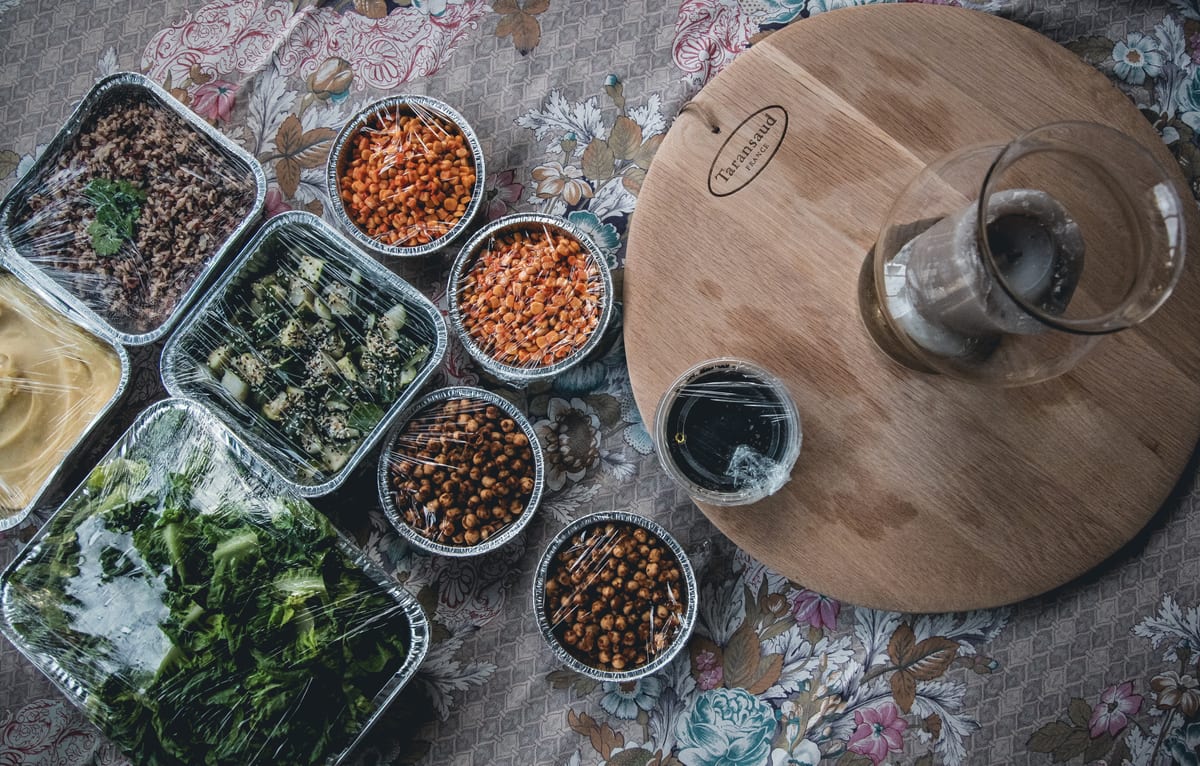 Prepared BBQ ingredients and sides arranged before Sunday Roast service